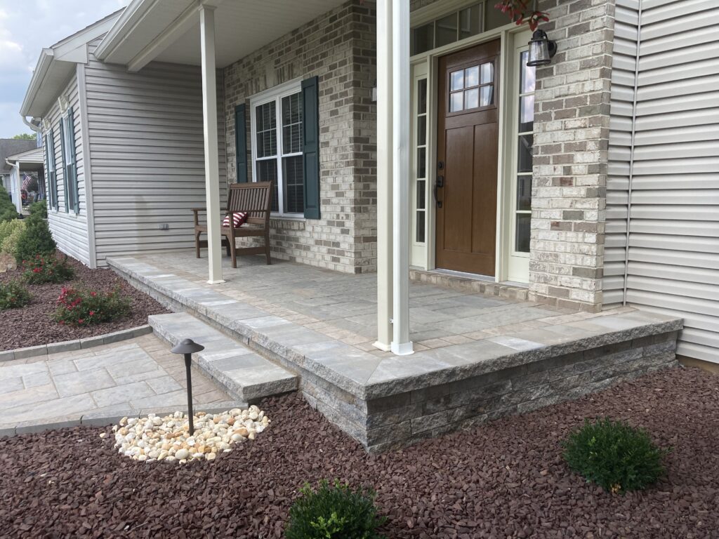 Custom built paver porch with step to walkway and lighting in Coopersburg