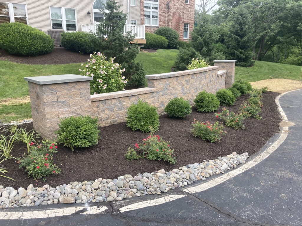 Landscaped and hardscaped entrance to an HOA managed property in Saucon Valley
