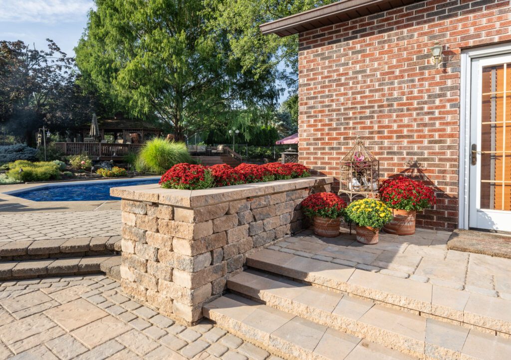 Techo-blok paver patio and wall leading to paver pool deck in Zionsville