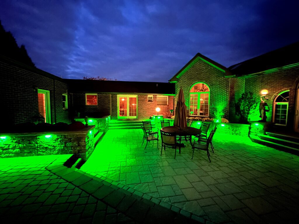 Bluetooth LED green lighting over techo-blok patio and retaining walls in Emmaus