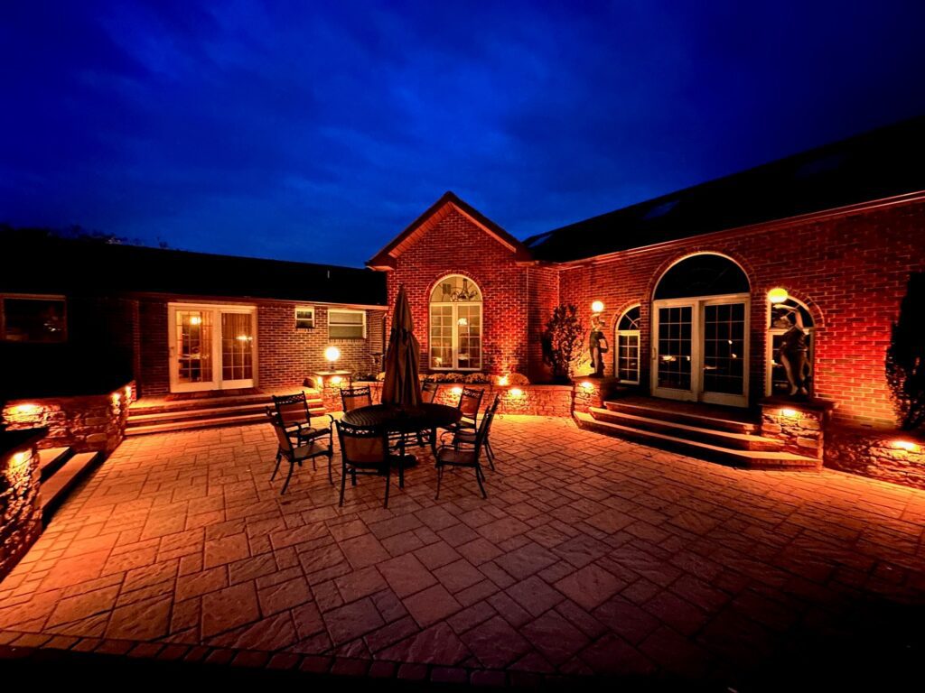 Outdoor lighting with paver patio and steps in Emmaus