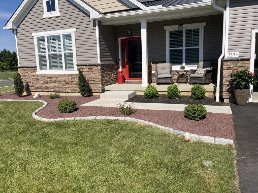 Landscaped walkway with edge stone and decorative stone in Macungie