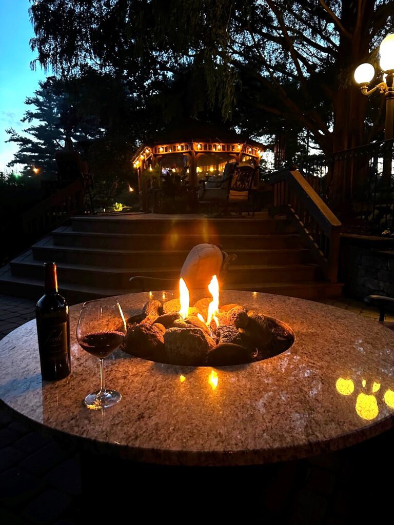 Firepit with outdoor lighting in Gilbertsville
