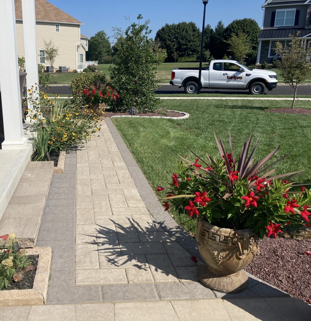Techo-blok walkway with healthy lawn and landscaped yard in Macungie