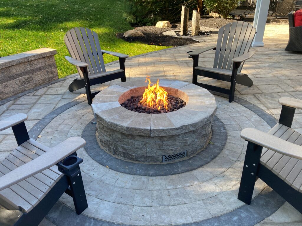 Paver patio with firepit and chairs