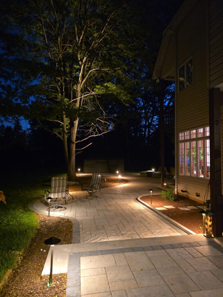 Dramatic outdoor landscape patio with lighting