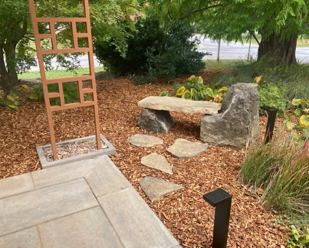 Custom stone bench off of a paver walkway